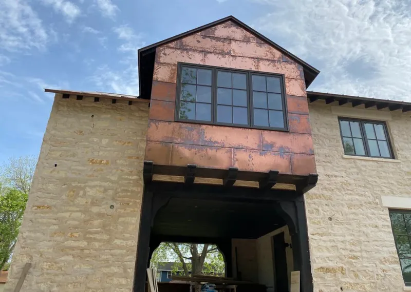 Copper metal panel facade on a stone building for Metal Roof Coating in Riverside